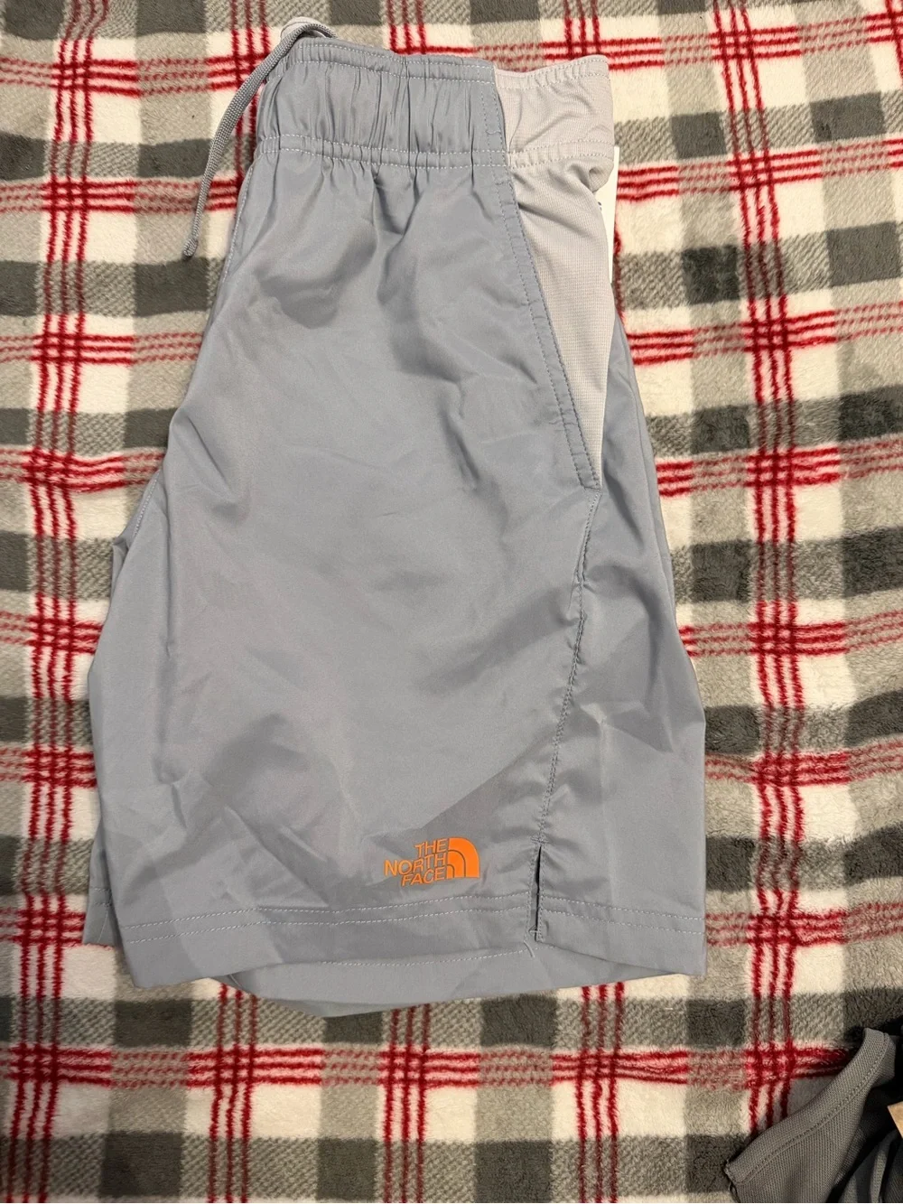 The North Face Men's Pale Blue Athletic Shorts with White Trim